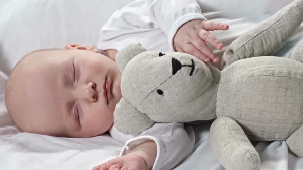 Baby Sleeping with Toy