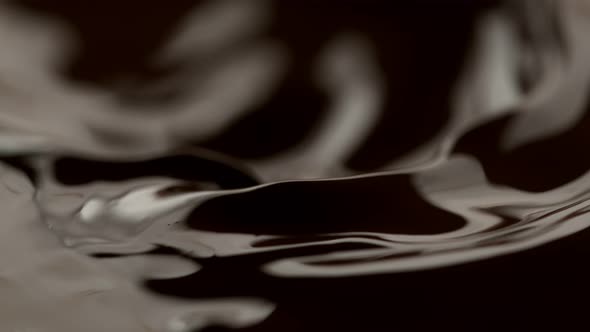 Super Slow Motion Shot of Waving Melted Dark Chocolate at 1000 Fps