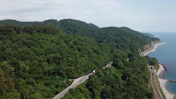 Aerial View From Drone of Curve Road with a Car on the Mountain with Green Forest in Russia
