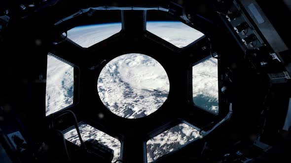 International Space Station Cupola looking Down at the Earth from Space.