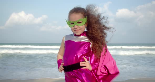 Baby Girl Plays a Superhero Makes Flight Movements Flies Forward with His Hand Raised Forward