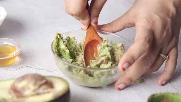 Making Homemade Natural Avocado Cosmetic on Table