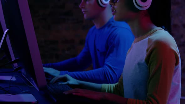 Woman and man working together at computers