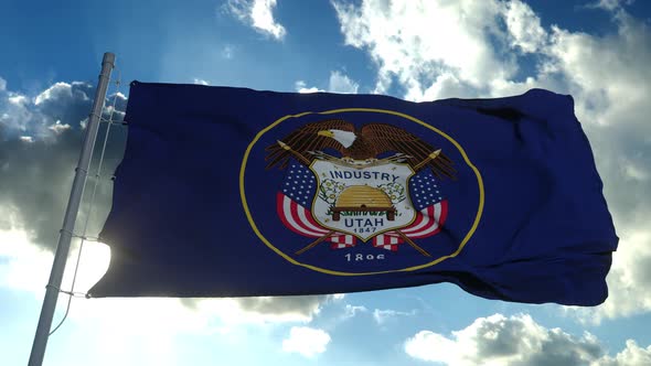 Flag of Utah Waving in the Wind Against Deep Beautiful Clouds Sky