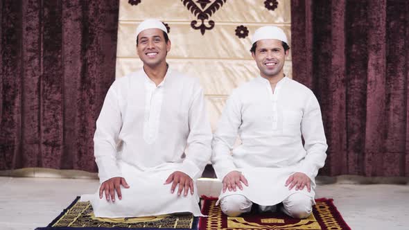 Two Muslim men doing adaab