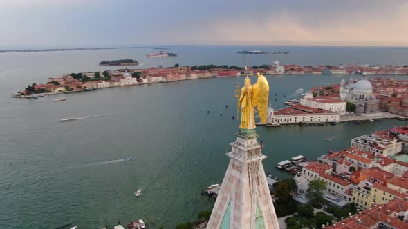 Statue of archangel Gabriel on St Mark's Campanile in St Mark's Square in Venice