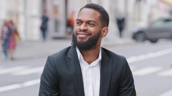 Headshot of Smiling Bearded African Ethnicity Confident Wealthy Businessman Wearing Suit Looking