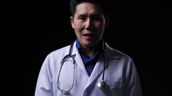 Doctor posing and looking at camera with speech presentation data