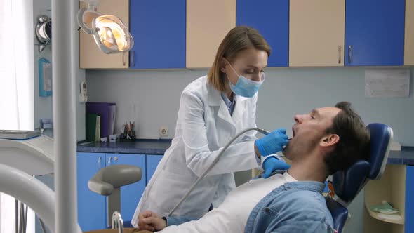 Male Patient Receiving Tooth Decay Treatment