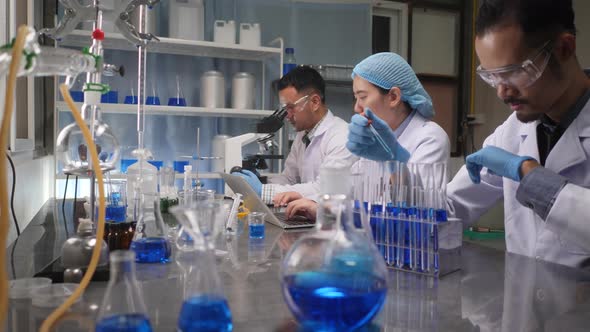 scientist team has researching in the laboratory, meeting and writing analysis results