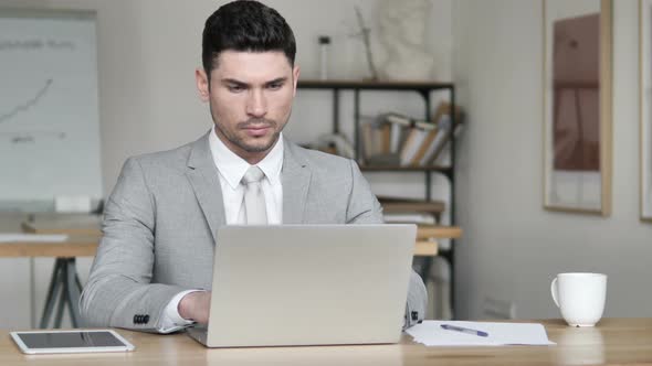 Businessman Working On Laptop