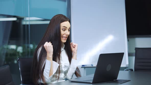 Business Woman Reacting Emotionally at Successful Case