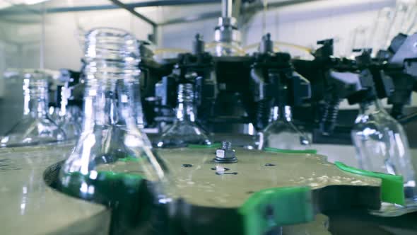Revolving Conveyor Is Displacing Empty Glass Bottles