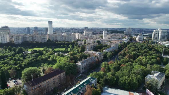 Aerial View of Metropolis City Skyline with Skyscrapers Green Trees and Sky