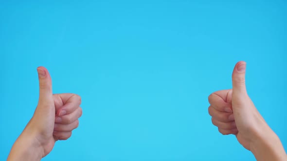 Woman Hands Pointing on Copyspace and Showing Thumbs Up Over Blue Background