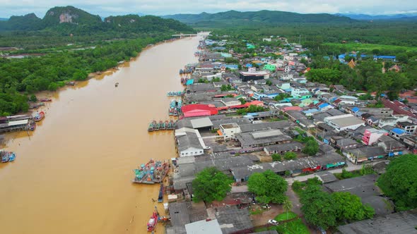 Aerial shot of river and local fisherman village beside the sea