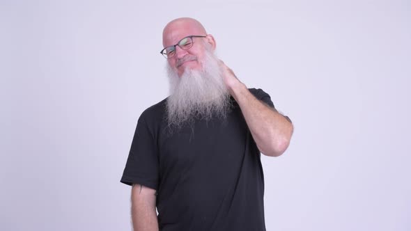 Stressed Mature Bald Bearded Man Having Neck Pain