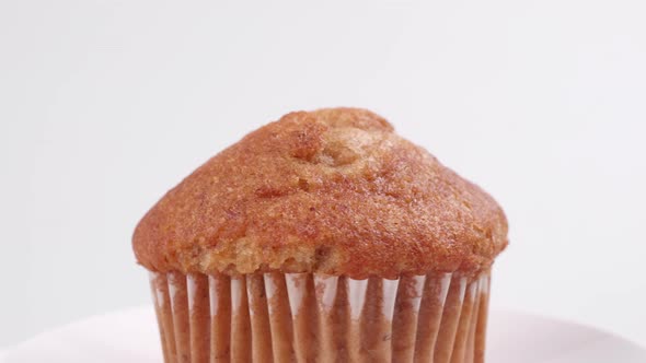 Muffins banana with white background shallow focus and slowly rotating.