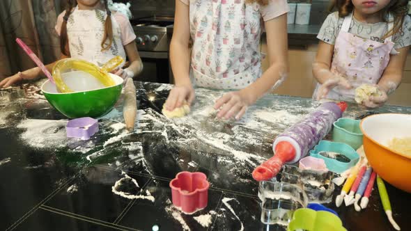 Girls rolling dough