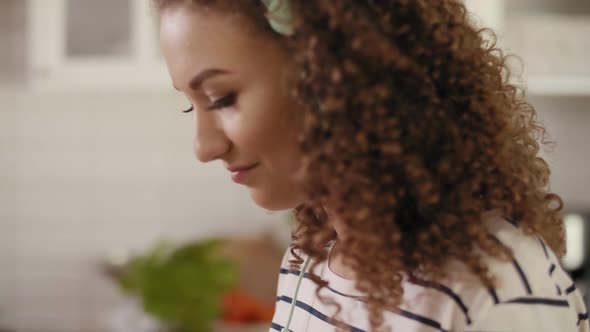 Tilt down view of woman turning on her favorite song