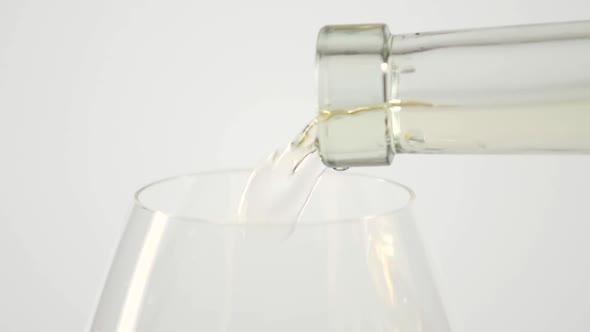 The Empty Glass Is Poured White Wine, White, Slowmotion, Closeup