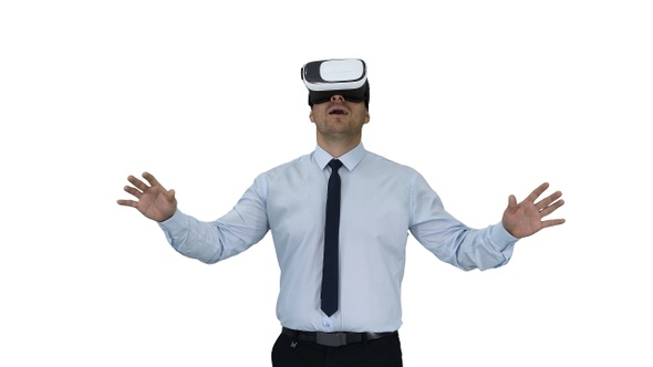 Astonished young businessman wearing VR glasses Concept