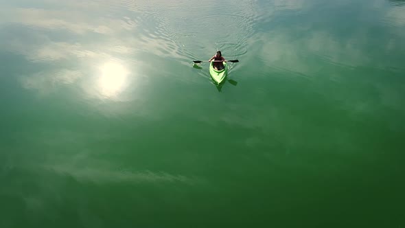 Aerial view of a kayaker on Hatta lake in Dubai.