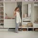 Girl on the Background of the Closet Trying on a White Shirt - VideoHive Item for Sale
