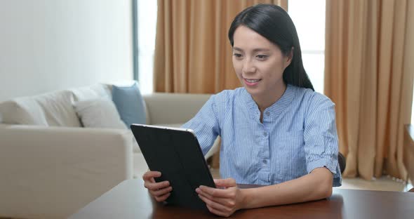 Woman use of tablet computer at home