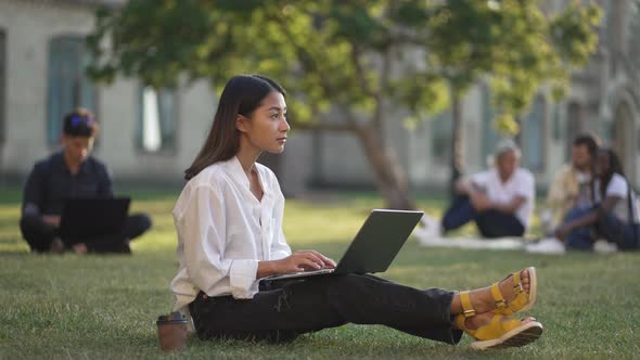 Cute Asian Girl Student Working on Laptop Outdoors