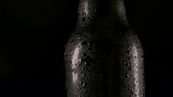 Beer Bottle with Drops of Water