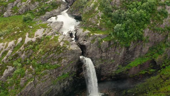 Drone Over Waterfall Into Rocky Valley