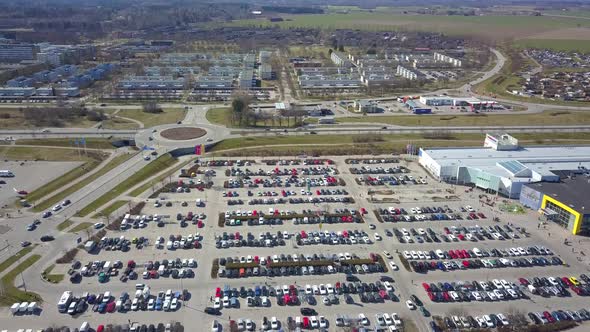 Top aerial view of many cars on a parking lot or sale car dealer market.