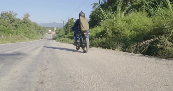 Driver Riding Motorcycle On The Country Road