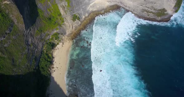 Aerial drone view of a secluded deserted beach coastline