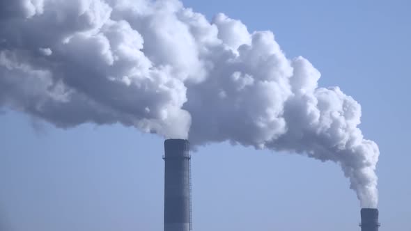 Smoke From the Chimneys Plant Rises Into the Clouds 004