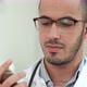 Male Doctor Texting on a Smartphone - VideoHive Item for Sale