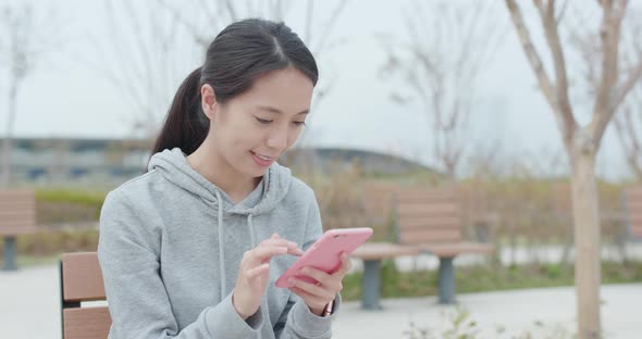 Woman use of mobile phone for online