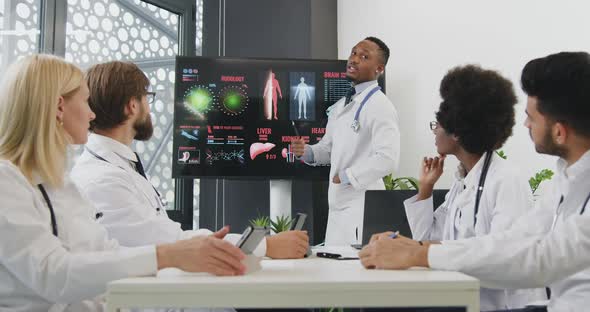 Team of Medical Coworkers which Clapping Hands After Successfully Finished Presentation