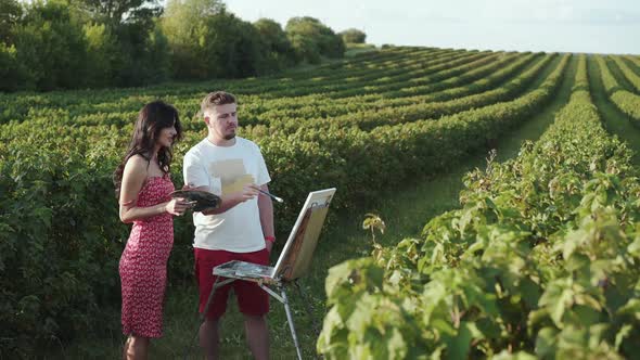 Beautiful Couple of Artists Creatives a Landscape and Talks in Bush Field