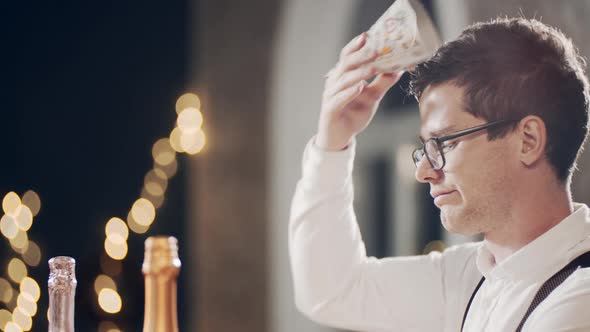 Close Up Portrait of Unhappy and Lonely Caucasian Guy Sitting at Table During Birthday Party