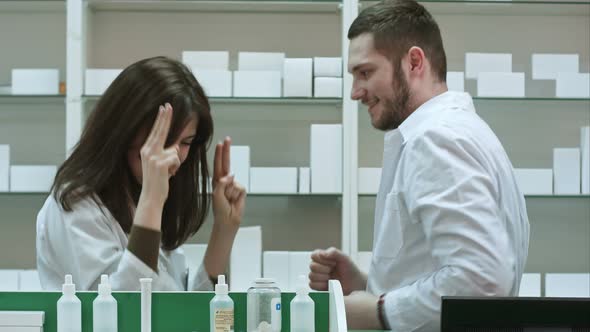 Funny Young Pharmacist Dressed in White Uniform Dancing at Pharmacy