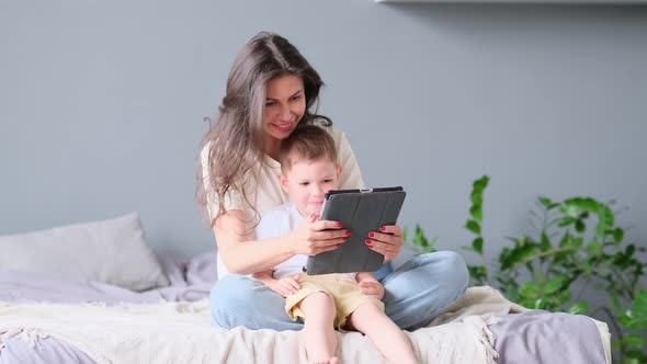 Mother and Son with Tablet at Home