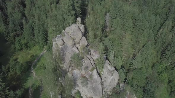 Stone rocks Ternoshorska Lada amidst beautiful scenic Carpathian forests, Ukraine