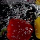 Red and yellow sweet peppers falling in the water - VideoHive Item for Sale
