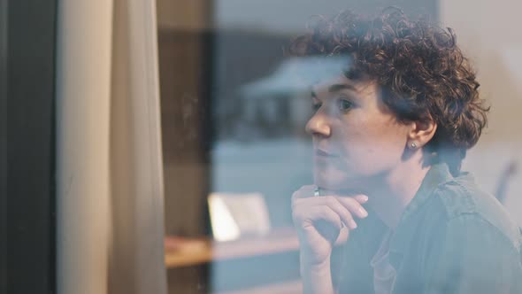 Thoughtful Woman Looking At Window