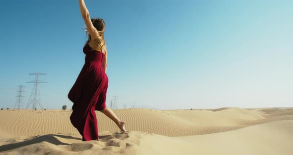 Rub Al Khali Desert Flexible Woman is Dancing on the Sand Bright Sun