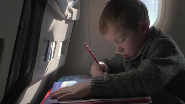 Close Up View of Small Boy Learning To Writing with Pencil