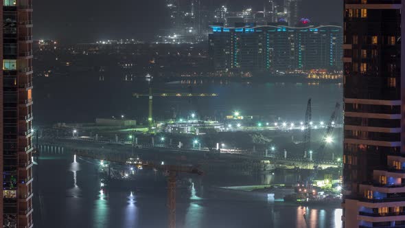 Aerial View to Dubai Marina Skyscrapers with Construction Site and Palm Jumeirah Island on