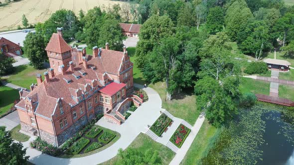 Jaunmoku Brick Medieval Castle Near Tukums, Latvia  Aerial Dron 4k Shot Jaunmokas Manor Park.